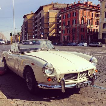 Old Triumph car in street - бесплатный image #332181
